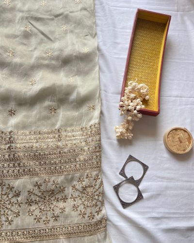 Ivory Pure Cosmos Tissue Silk Fabric with Buti Work and Heavy Zari & Sequin Embroidery Border