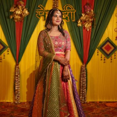 Multi coloured lehenga set with Rani multi blouse and mehendi net dupatta