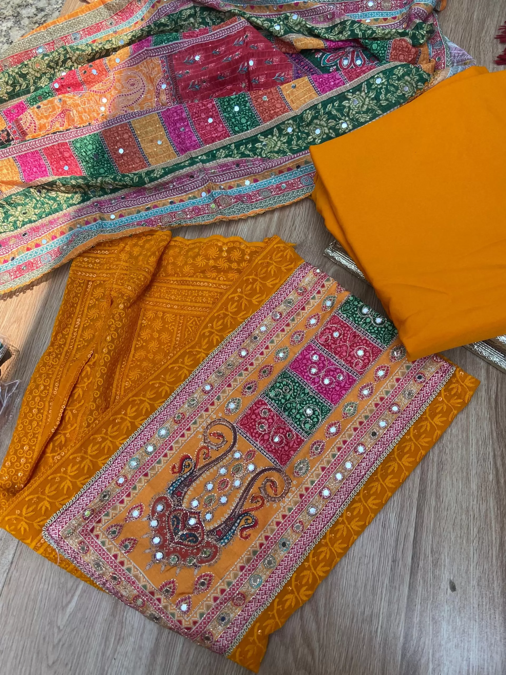 Orange Chikankari georgette piece with multi floral patch and dupatta with mirror detailing unstitched suit set