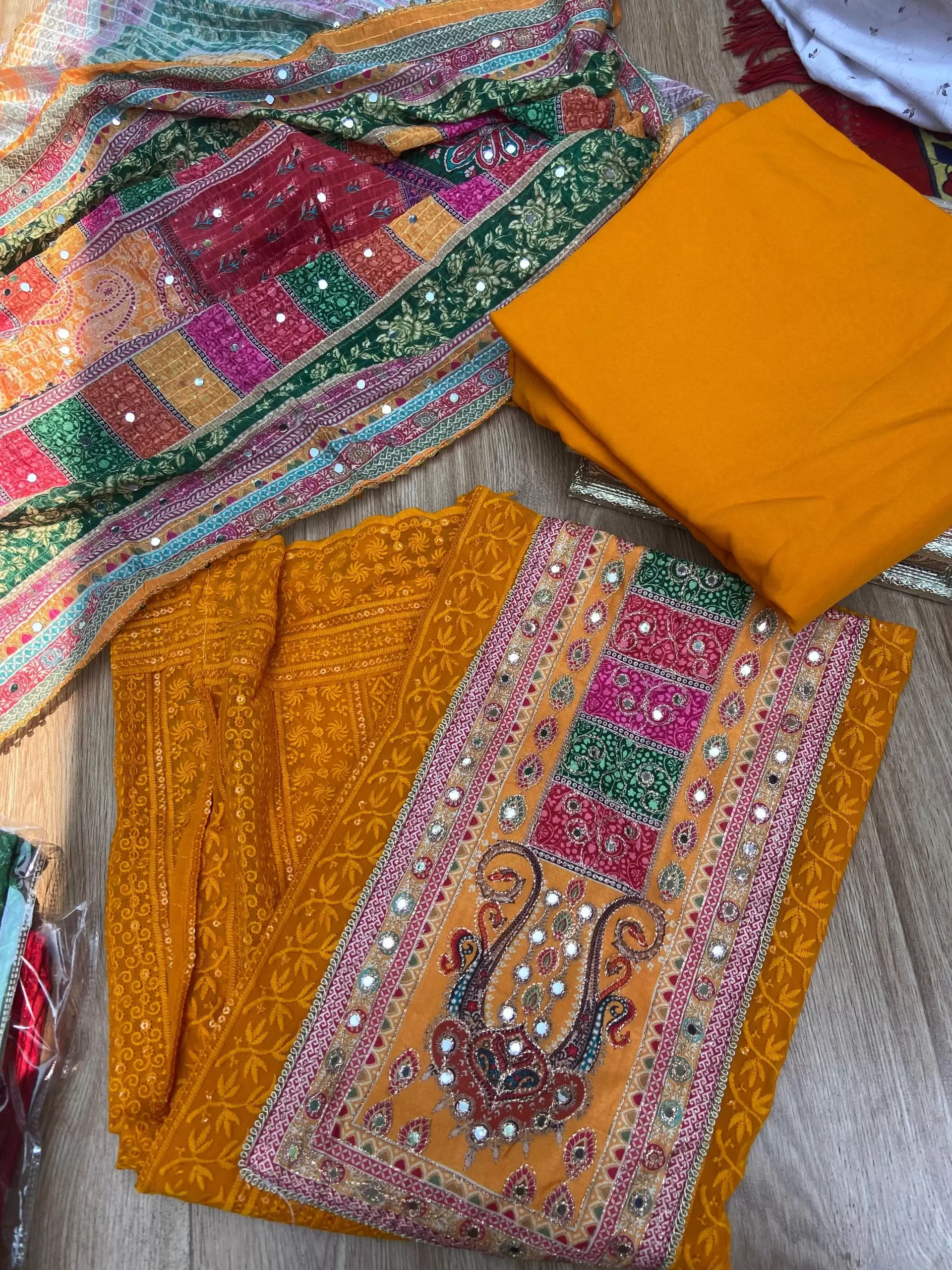 Orange Chikankari georgette piece with multi floral patch and dupatta with mirror detailing unstitched suit set