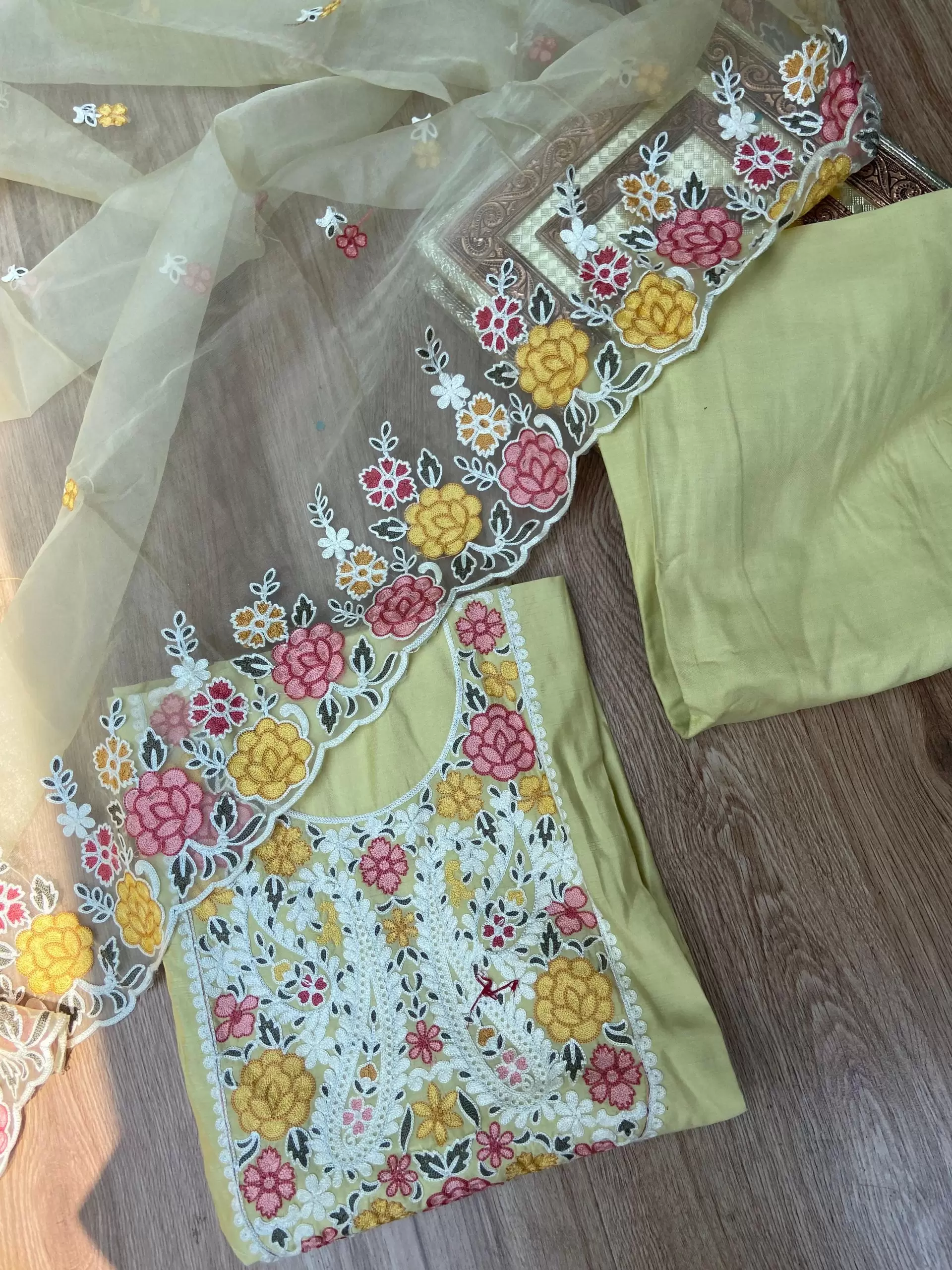 Yellow pure cotton heavy multi coloured thread embroidered unstitched suit set with organza dupatta