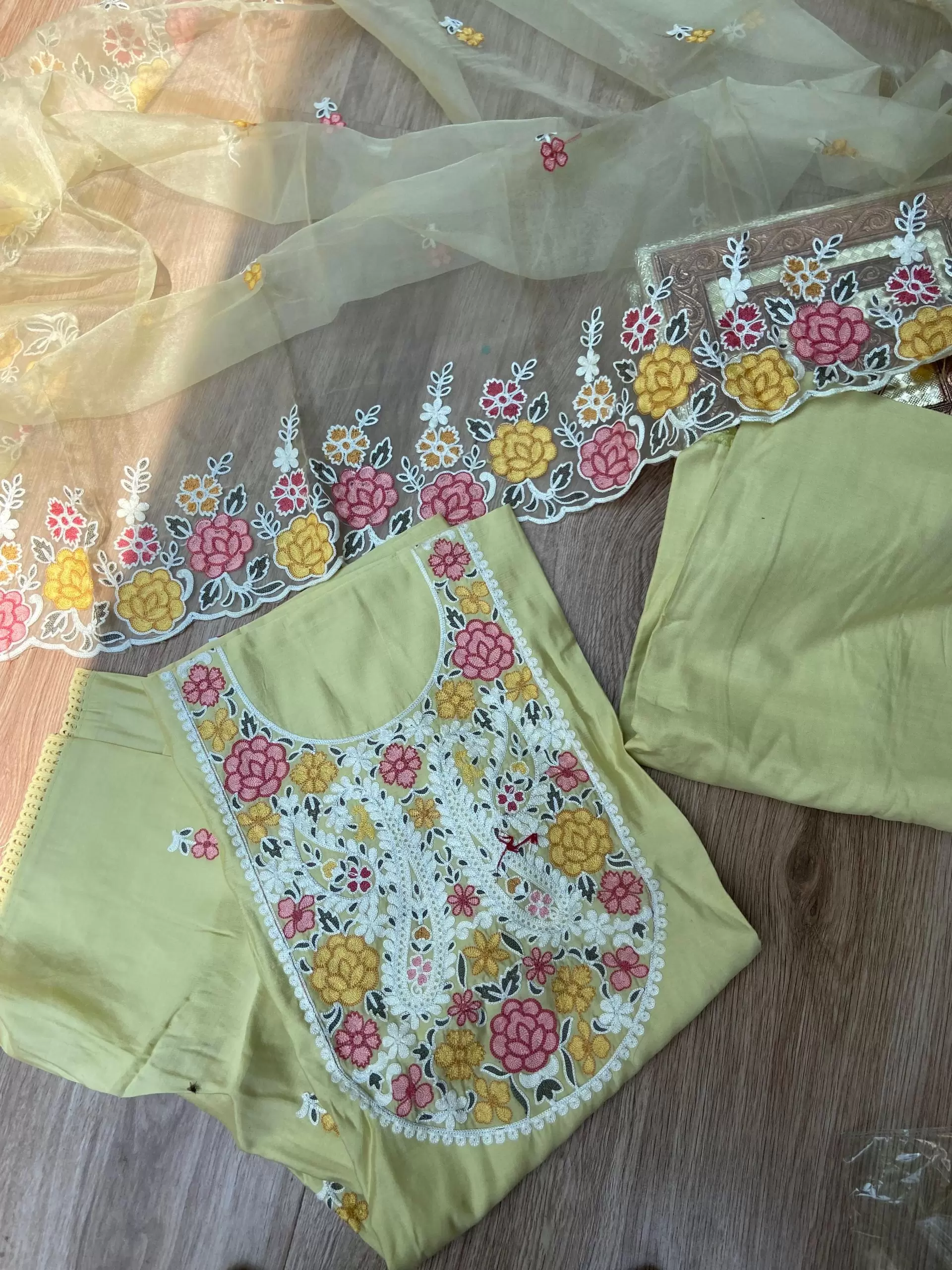 Yellow pure cotton heavy multi coloured thread embroidered unstitched suit set with organza dupatta