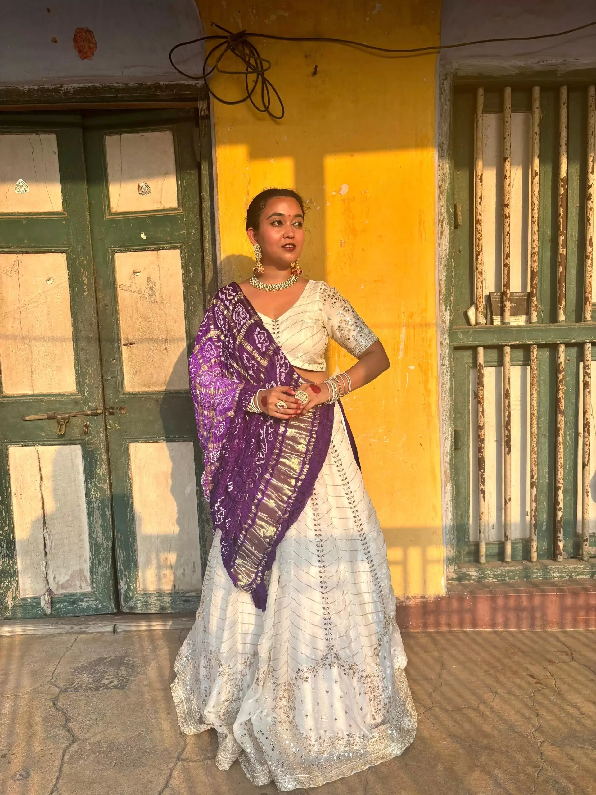 White chandani lehenga made from organza satin with heavy daman style embroidery( with white dupatta)