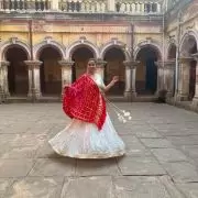 White chandani lehenga made from organza satin with heavy daman style embroidery( with white dupatta)