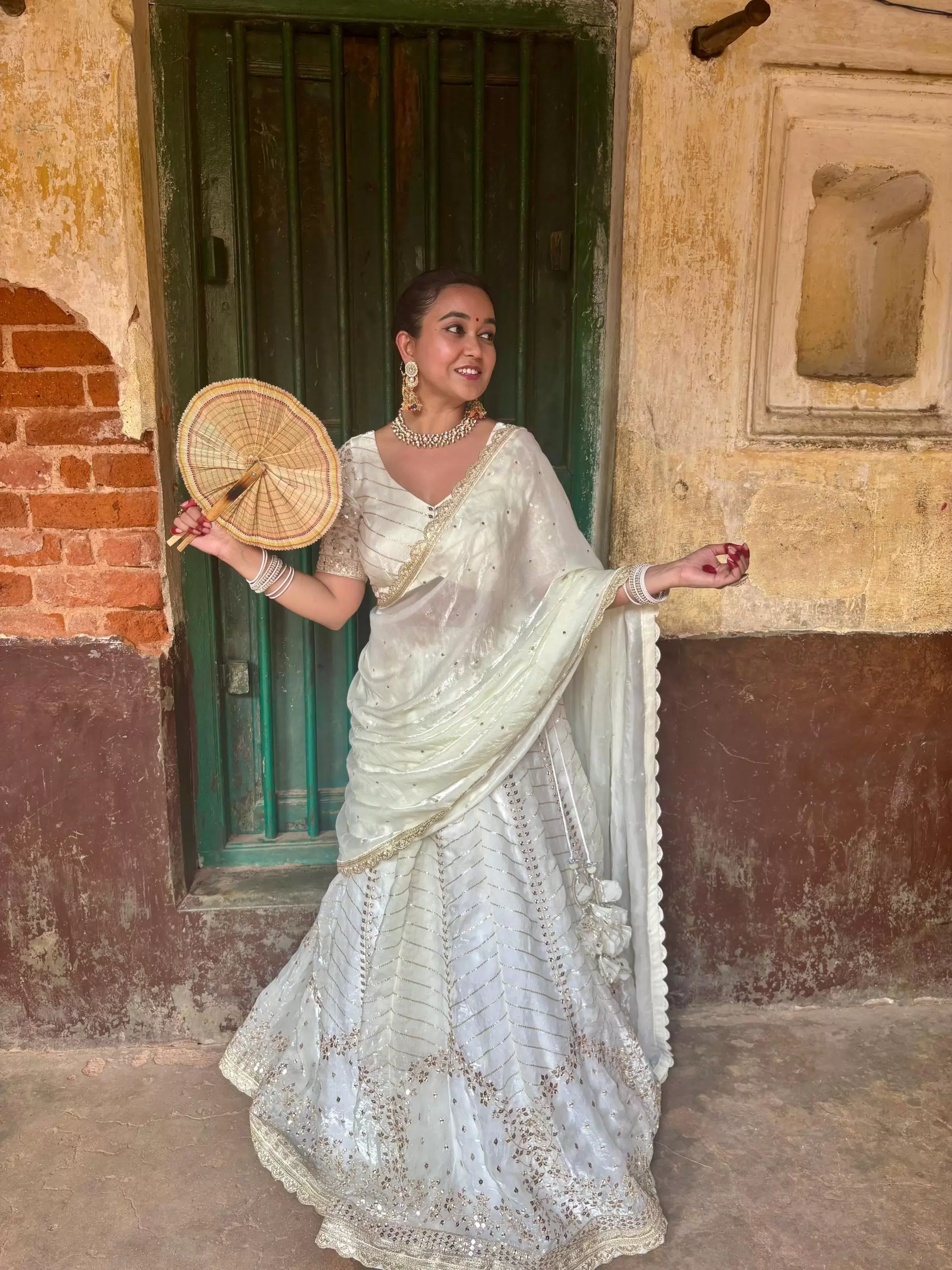 White chandani lehenga made from organza satin with heavy daman style embroidery( with white dupatta)