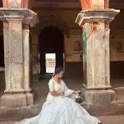 White chandani lehenga made from organza satin with heavy daman style embroidery( with white dupatta)