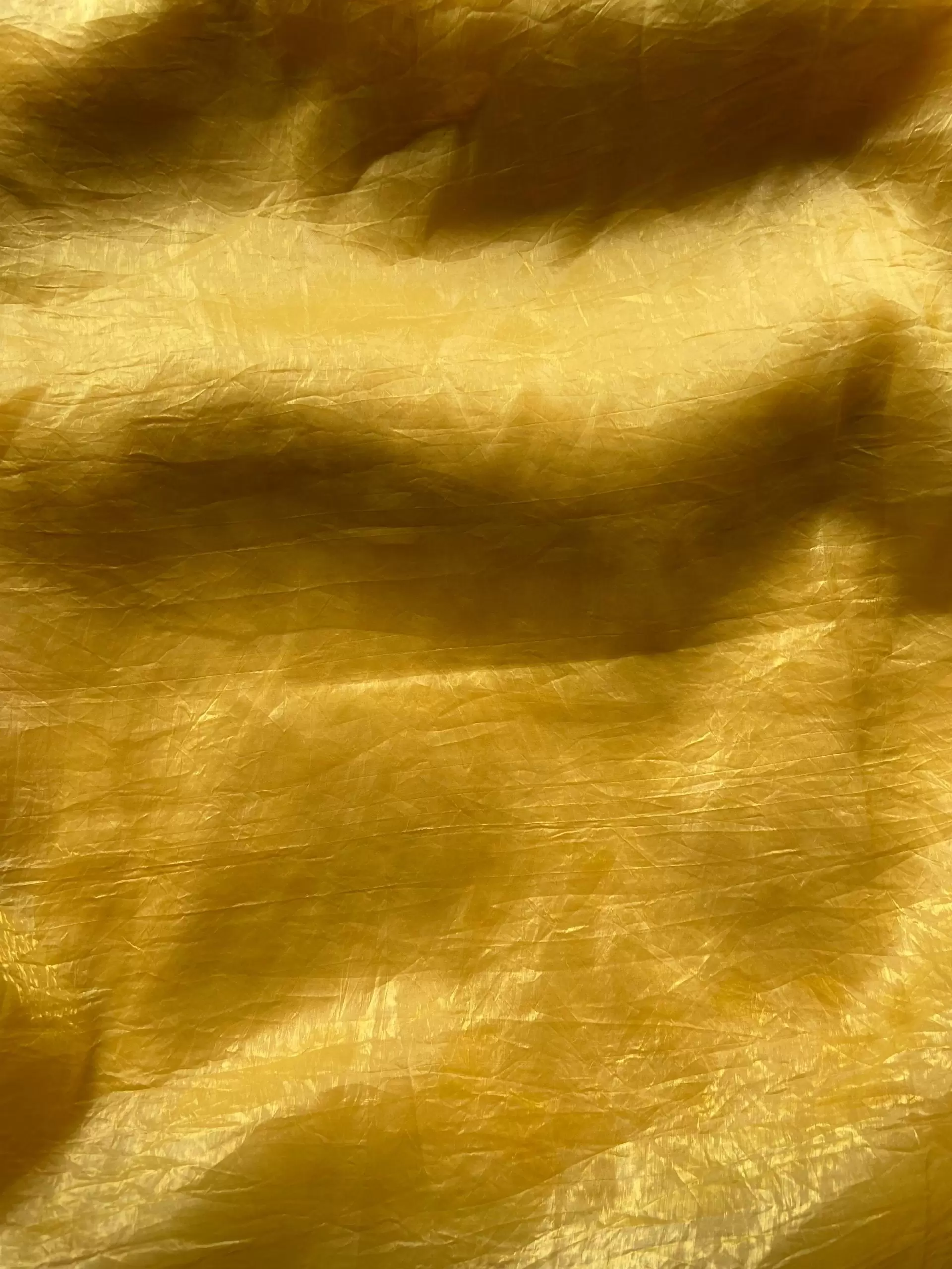 Yellow crush tissue silk fabric