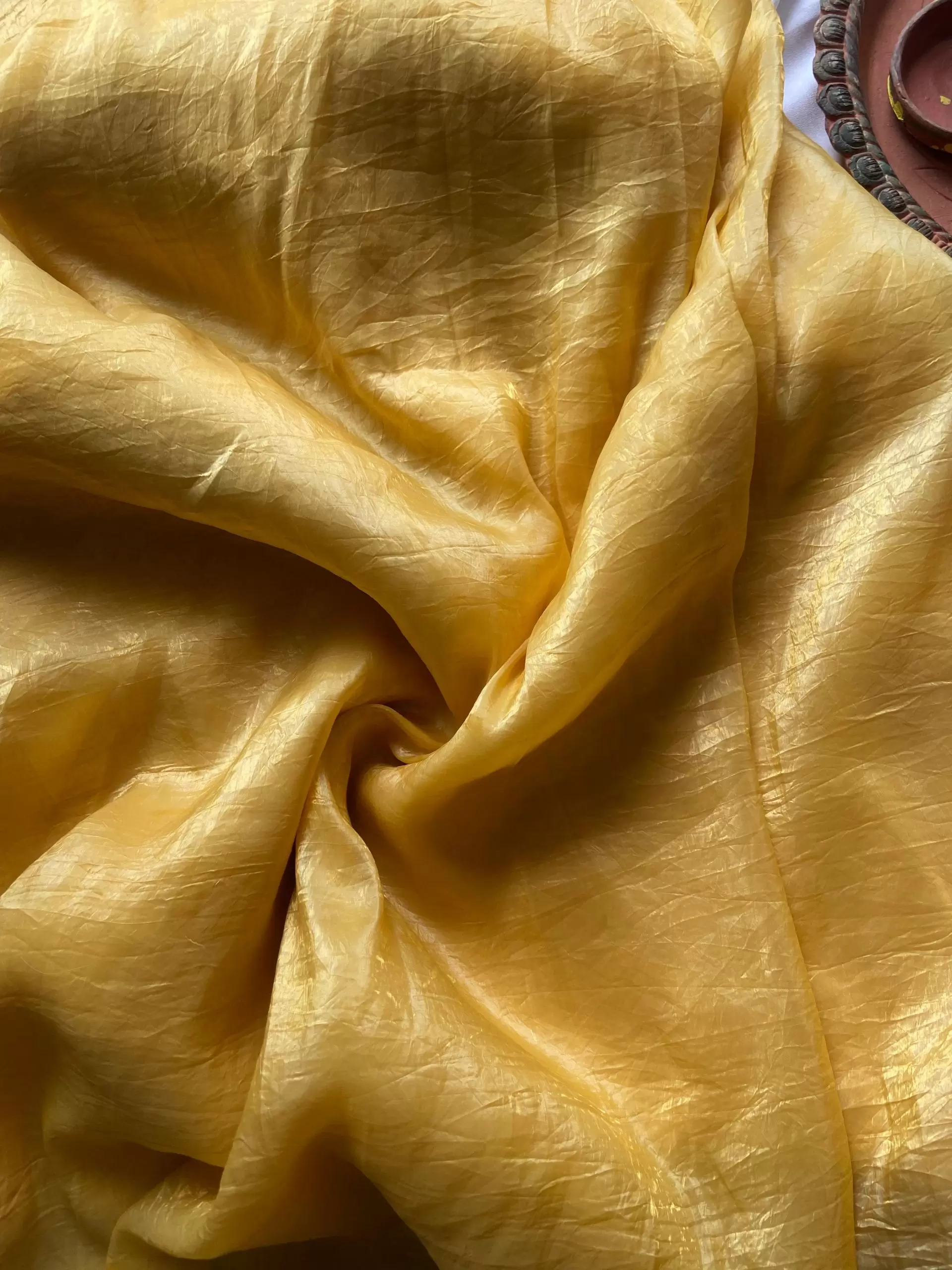 Yellow crush tissue silk fabric