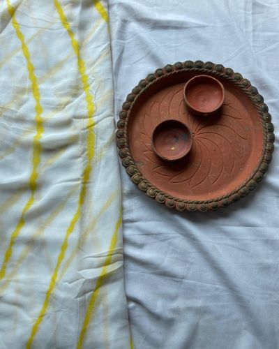 Hand dyed leheriya in yellow colour on white, pure georgette fabric