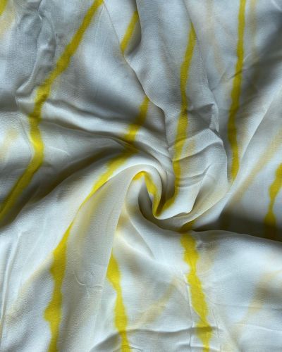 Hand dyed leheriya in yellow colour on white, pure georgette fabric