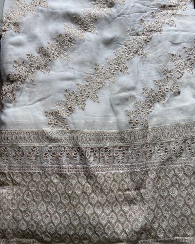 Heavy zari embroidery with stripe pattern on white georgette fabric