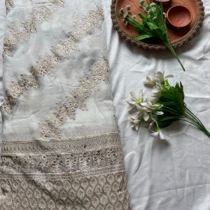 Heavy zari embroidery with stripe pattern on white georgette fabric