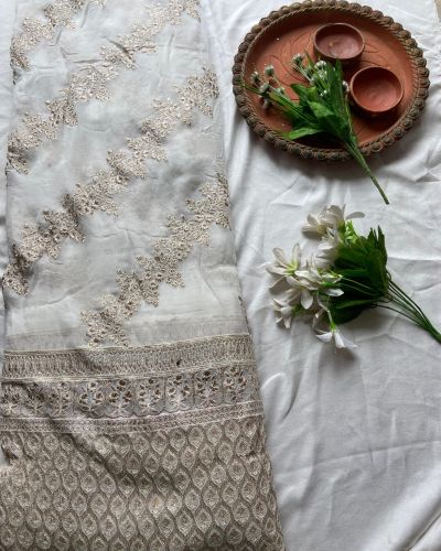 Heavy zari embroidery with stripe pattern on white georgette fabric