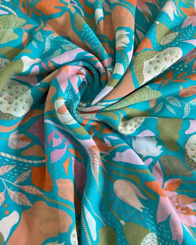 Aqua blue printed georgette fabric with multi colour floral pattern
