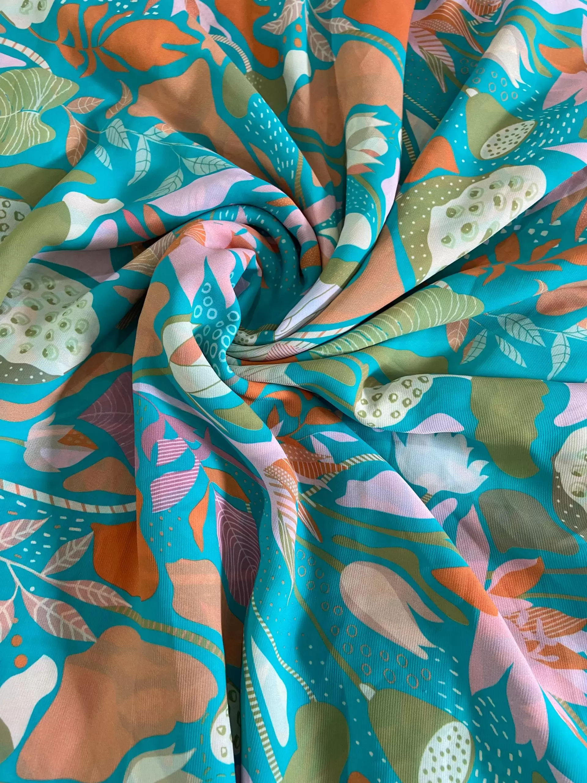 Aqua blue printed georgette fabric with multi colour floral pattern
