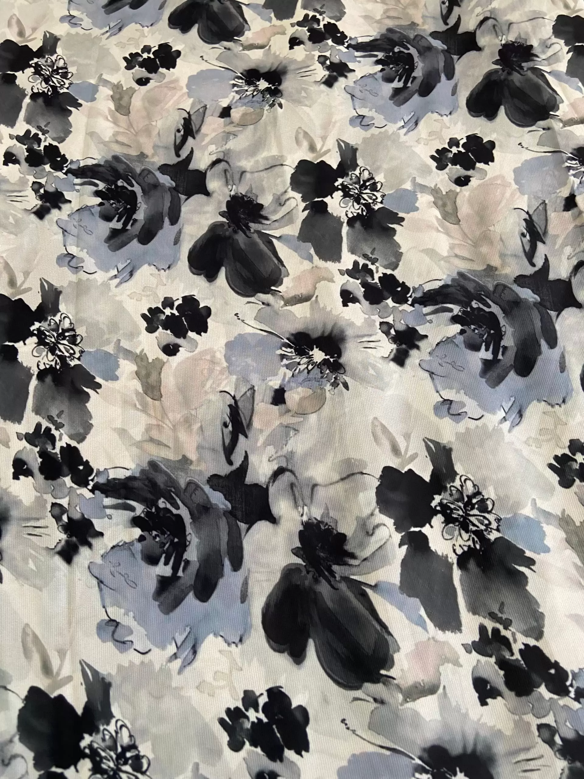 Grey printed georgette fabric with black and white floral pattern