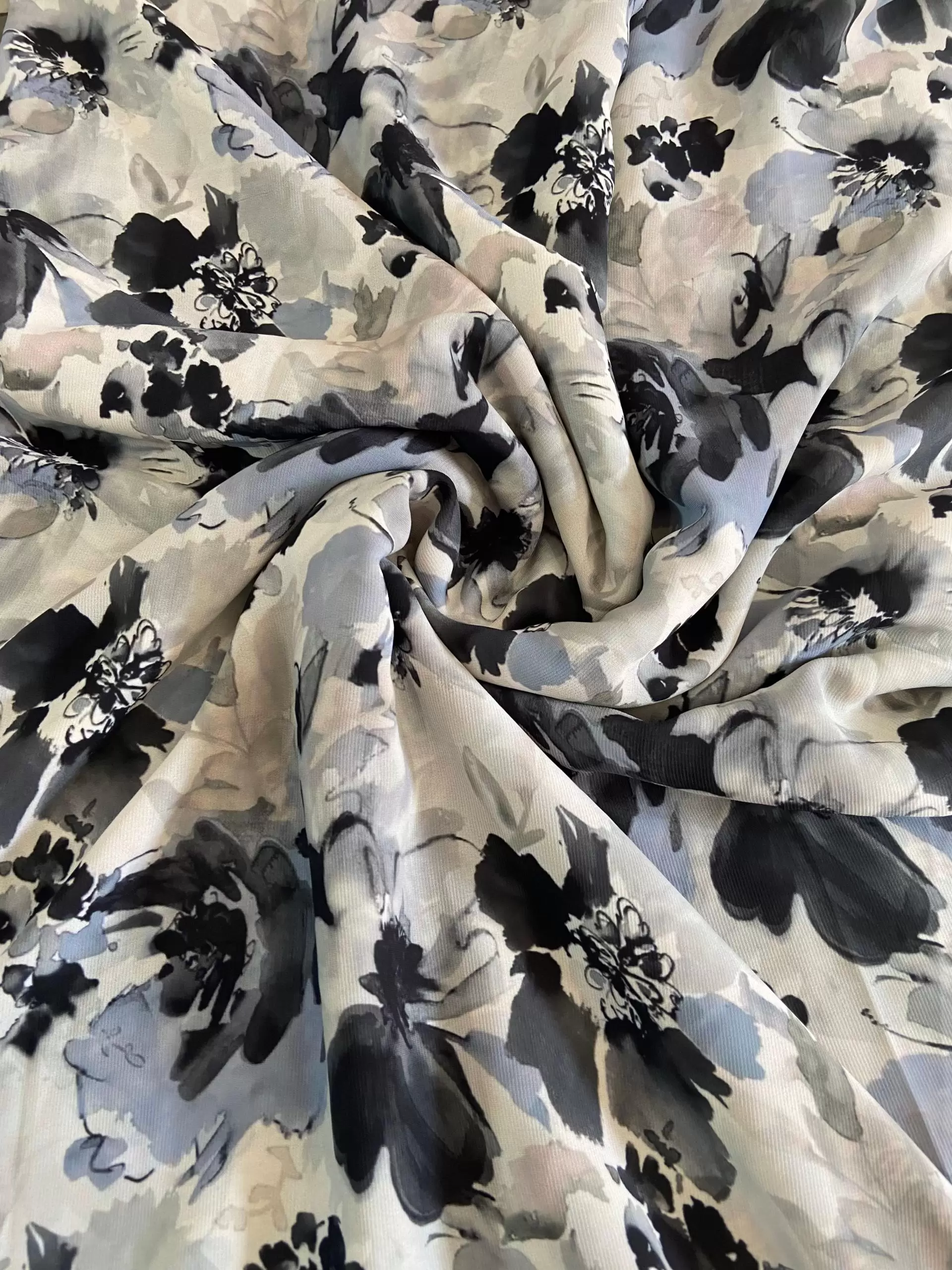 Grey printed georgette fabric with black and white floral pattern