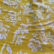 Yellow printed georgette fabric with white floral pattern
