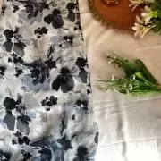 Grey printed georgette fabric with black and white floral pattern