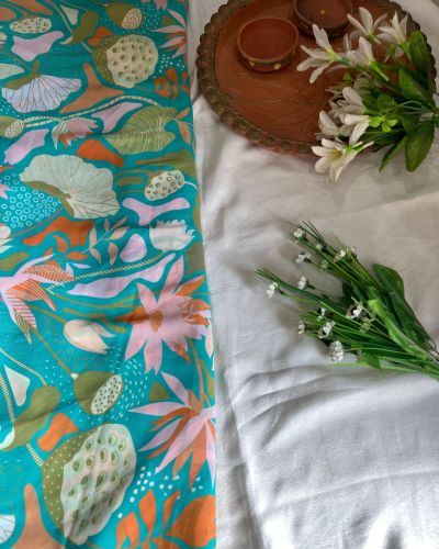 Aqua blue printed georgette fabric with multi colour floral pattern