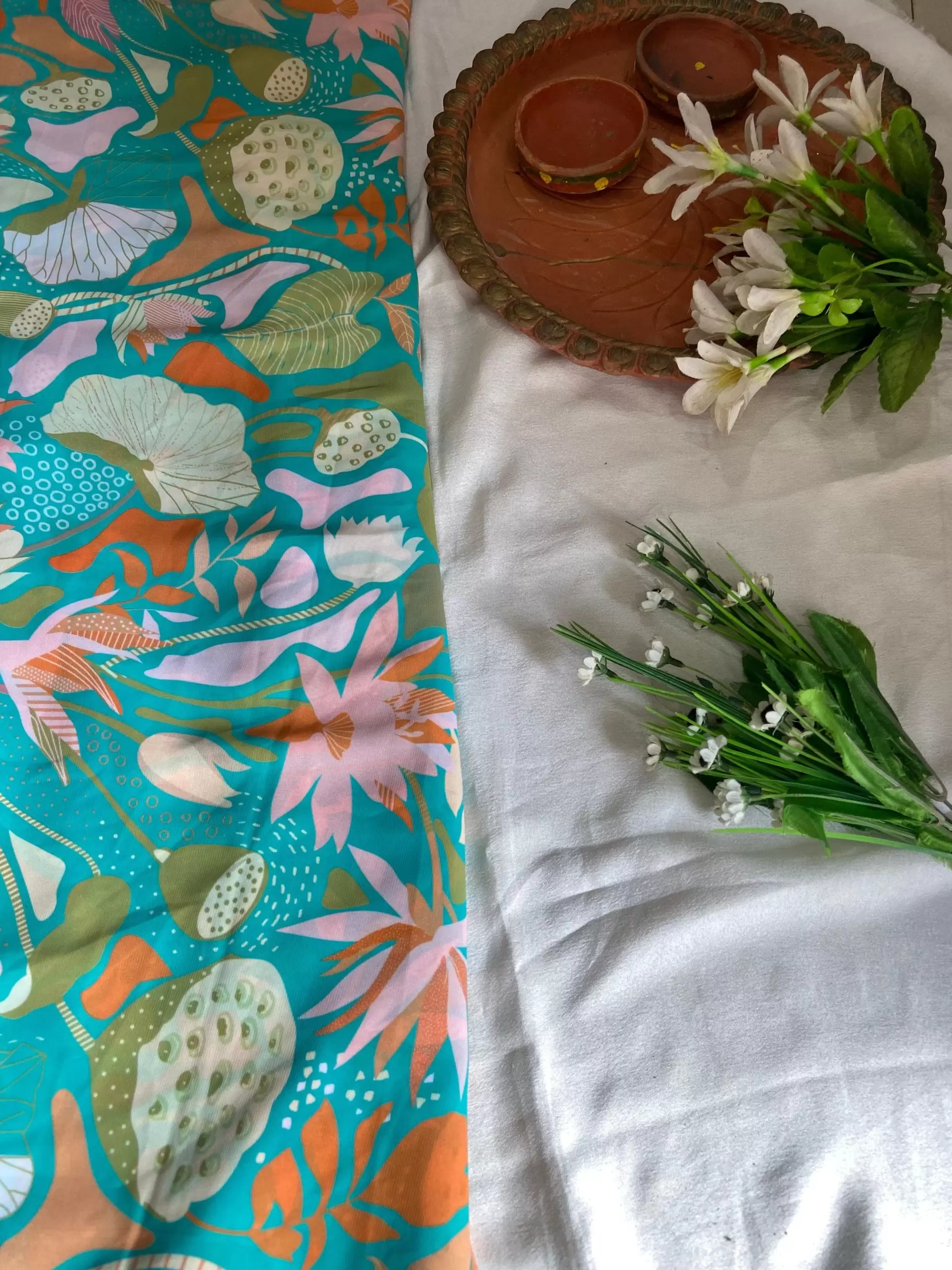 Aqua blue printed georgette fabric with multi colour floral pattern